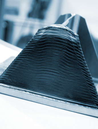 3d printed metal model close-up. Model printed on a 3D printer made of metal. Three-dimensional metal object created by a 3d printer from metal. 3D printing additive modeling manufacturing technologyの写真素材