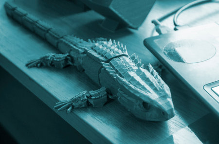 Object printed on 3D printer. Abstract toy green crocodile with many different detailed parts on table and created on 3d printer. Concept FDM 3D Printing. Additive modern new progressive technologyの写真素材