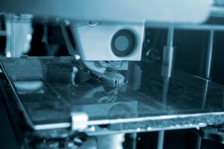 The process of printing on a 3D printer. 3D printer printing object from molten plastic close-up....