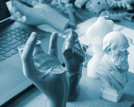 Creative art models printed on a 3D printer. Different objects created on a 3D printer from molten plastic. 3D printer FDM technology. Modern new technologies. Modern additive progressive technologiesの写真素材
