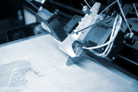 The process of printing on a 3D printer. 3D printer printing object from molten plastic close-up....
