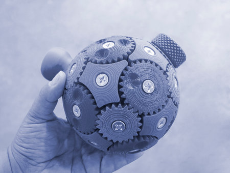 Person holding in hand three-dimensional model printed on 3D printer. An object created on 3D...