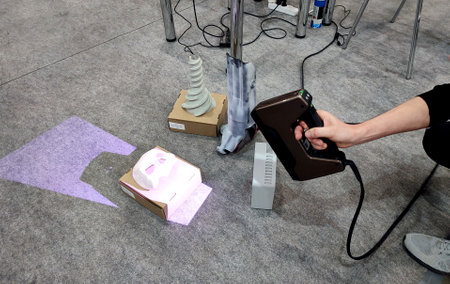 3D scanning. Working portable 3D scanner. Man scanning an object with a portable 3D scanner. Manual...