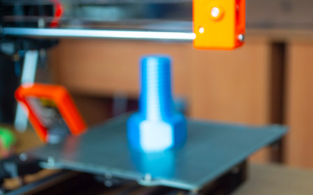 3D printer printing prototype of bolt from molten plastic. Prototype model of bolt on 3D printer...