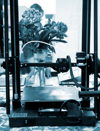 Empty working surface of 3D printer. 3D printer not working. Desktop 3D printer without printing process.の写真素材