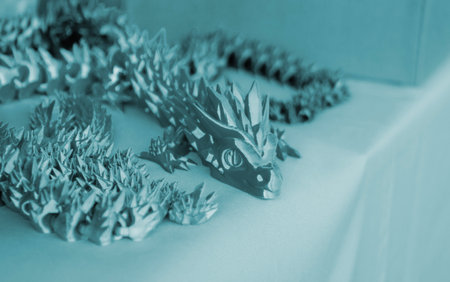 Creative multi-colored object printed on 3D printer from melted colored plastic. Artistic model printed by 3D printer from multi-colored plastic. Modern additive 3d printing technologies. Blue colorの写真素材