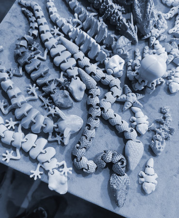 Art objects printed on a 3D printer. Various creative models created on a 3D printer from molten plastic. Concept 3D Printing. New modern 3D Printing additive technology. Blue colorの写真素材