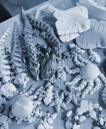 Art objects printed on a 3D printer. Various creative models created on a 3D printer from molten plastic. Concept 3D Printing. New modern 3D Printing additive technology. Blue colorの写真素材