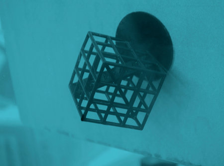 Object printed on 3D printer from rubber on working surface of 3D printer. Model created on 3D printer from hardened rubber under influence of ultraviolet light. SLA 3D printing. Stereolithographyの写真素材