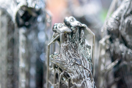 An object printed on a 3D printer from hardened rubber close-up. Model black color created on a 3D printer from hardened rubber under influence of ultraviolet light. SLA 3D printing. Stereolithographyの写真素材