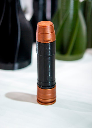Ammunition printed on a 3D printer. Ammunition created on a 3D printer from molten plastic. Modern...