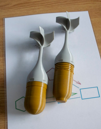 Bomb model for drone. Model of bomb printed on 3D printer from melted plastic. Body of bomb with...