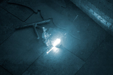 Laser cleaning of metal surfaces. Laser cleaning metal from rust. Glowing laser beam cleaning metal...