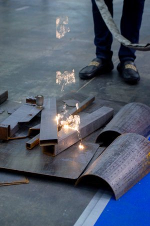 Person cleaning metal surface from rust with laser. Laser cleaning metal surfaces. Laser cleaning...