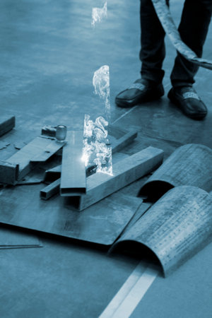 Person cleaning metal surface from rust with laser. Laser cleaning metal surfaces. Laser cleaning...