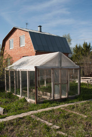The old selfmade greenhouseの写真素材
