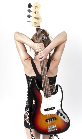 Girl on rock guitar on a white backgroundの写真素材