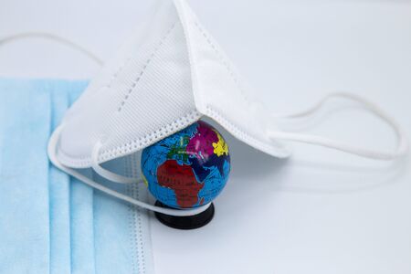 Surgical and healthcare concept.Isolated white medical mask. In the world.の写真素材