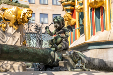 SchÃ¶ner Brunnen in Nuremberg's Hauptmarkt, a famous Gothic-style fountain inspired by a 14th-century spire, captured in bright daylight in the historic market square.の写真素材