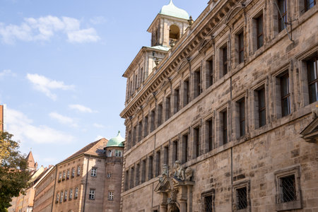 Altes Rathaus in Nuremberg, Germany, historic medieval town hall with Gothic architecture, clock tower, and charming old town streets under clear daylight.の写真素材
