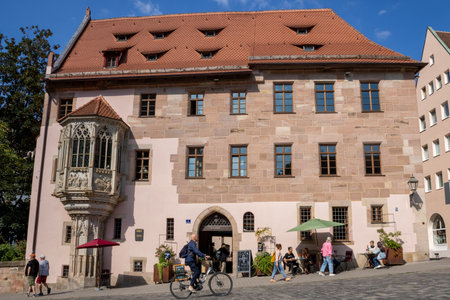 Sebalder Platz in Nuremberg, Germany, charming historic square with colorful facades, traditional architecture, cafes, and vibrant city life in the heart of old town.の写真素材
