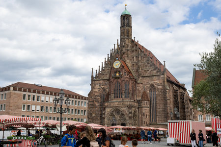 Gothic Frauenkirche in Nurembergâs Hauptmarkt, Germany, a stunning 14th-century Catholic church with restored inscriptions, historic artwork, and iconic medieval architecture.の写真素材