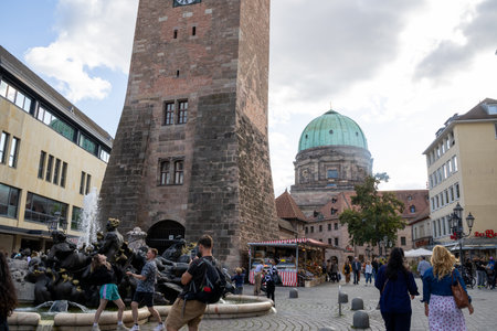 Nuremberg's WeiÃen Turm and St. Elisabeth Church captured in Bavaria, Germany, showcasing historic architecture, vibrant city life, and iconic medieval landmarks.の写真素材