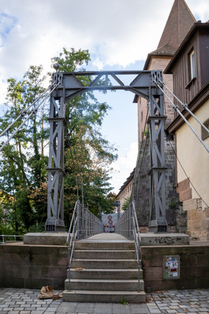 Historic view of Nuremberg, Bavaria, Germany, featuring Kettensteg, Schlayerturm, Grüner Turm, and the charming Hallertürlein tower.の写真素材