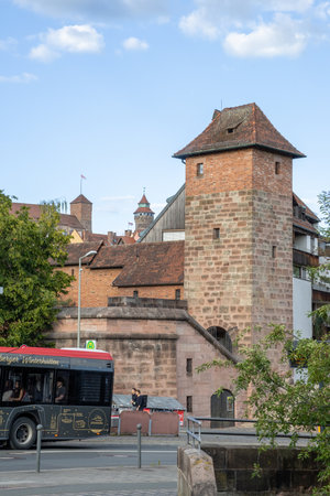 Historic city walls and medieval tower in Nuremberg, Bavaria, Germany, captured under clear light, showcasing iconic architecture and timeless old-town charm.の写真素材