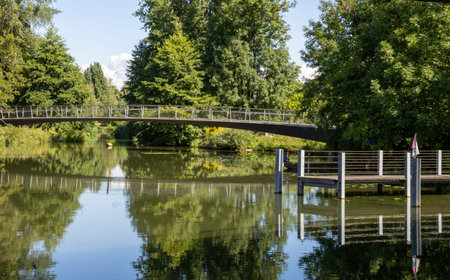 Scenic waterway surrounded by nature, green riverside landscape and relaxing European travelの写真素材