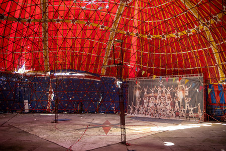 OURENSE, SPAIN - JULY 6, 2025: Inside the abandoned stadium pavilion of Benposta Circo de los Muchachos with old circus signage.
