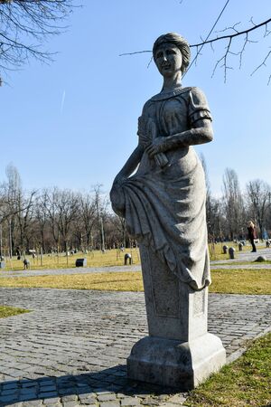 cement statue of a woman, Greek style, in the Alexandru Ioan Cuza park,in the capital of Romania, Bucharest. walk in the park. relaxing time.のeditorial素材