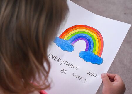 Everything will be fine, is gonna be alright in hand drawing letters and a rainbow with clouds drawn by a child. quarantine corona virus flu, the covid 19.の写真素材