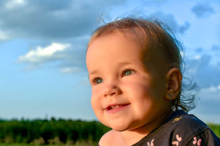 Portrait of a cute little caucasian baby girl with excited facial expressionのeditorial素材