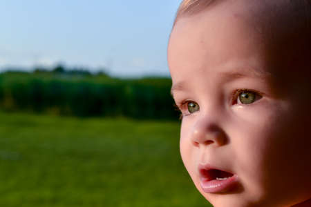 Portrait of a cute little caucasian baby girl with excited facial expressionのeditorial素材