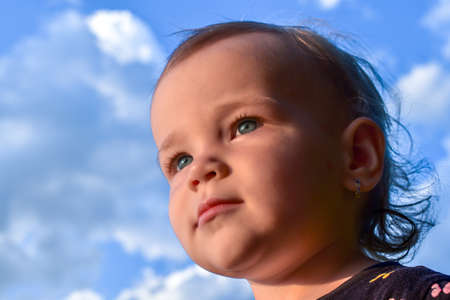 Portrait of a cute little caucasian baby girl with excited facial expressionのeditorial素材