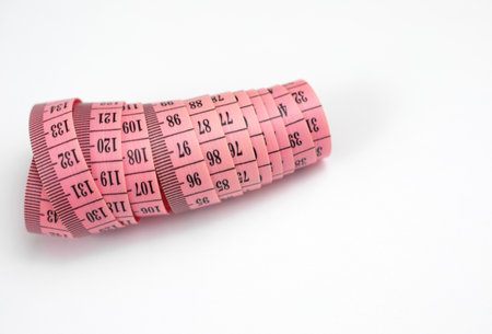 A single tape measure isolated on white backgroundの写真素材