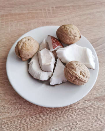 Nuts. Fresh coconut pieces and walnuts. Omega 3 and omega 6 fatty acids, healthy protein, vitamins...