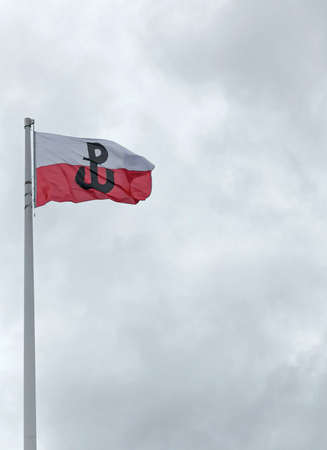 Polish flag with the symbol of Fighting Poland. Warsaw Uprising. 08/08/2021 Warsaw, Polandのeditorial素材