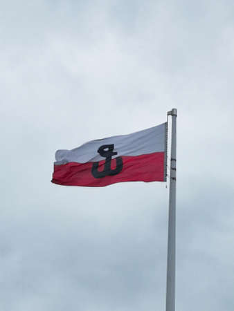 Polish flag with the symbol of Fighting Poland. Warsaw Uprising. 08/08/2021 Warsaw, Polandのeditorial素材