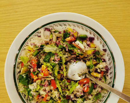 Healthy food fresh vegetable salad with spoonの写真素材
