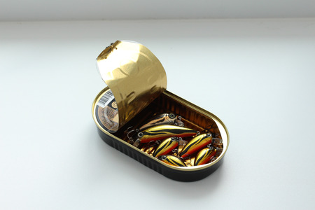 Fish lures in open tin can look like sprats.の写真素材