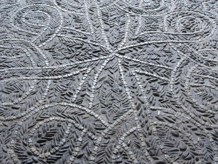Paving of earth color and geometric figures in perspective. Texture of old paving stone. Pavement...