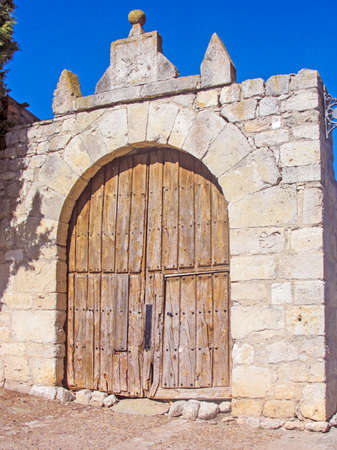 Ancient door of wood that gives access to the entrance of Santa Maria church of Wanba, a village of Valladolid, Spainの写真素材