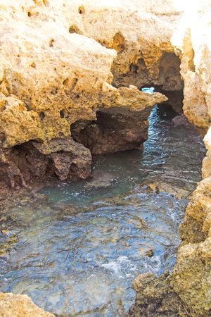Waterhole inside a cave of the natural site of Algar Seco in Carvoeiro, Lagoa, Algarve, Portugalの写真素材