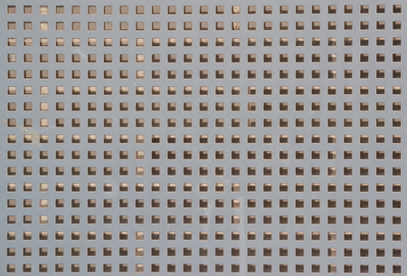 Gray metal texture, square holes background