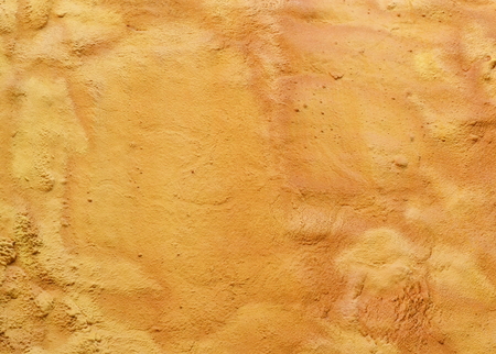 Whole wall covered with foam insulation. Gold wall. Yellow and orange old background. Abstract...