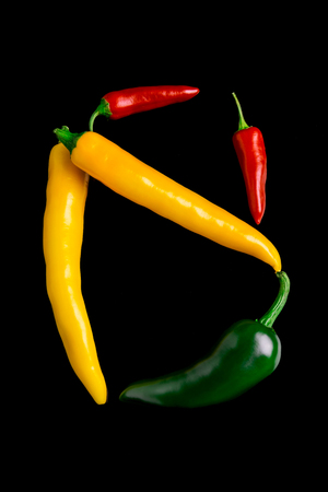 Chili peppers isolated on black backgroundの写真素材
