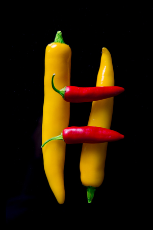 Chili peppers isolated on black backgroundの写真素材
