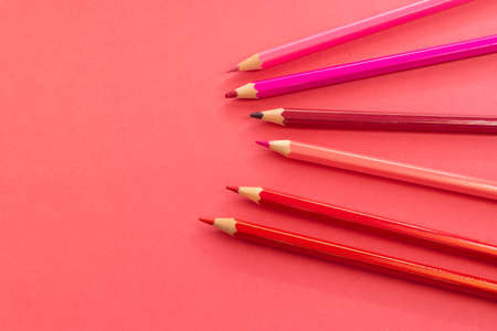 Pink pencils arranged disorganized and tilted up on pink backgroundの写真素材